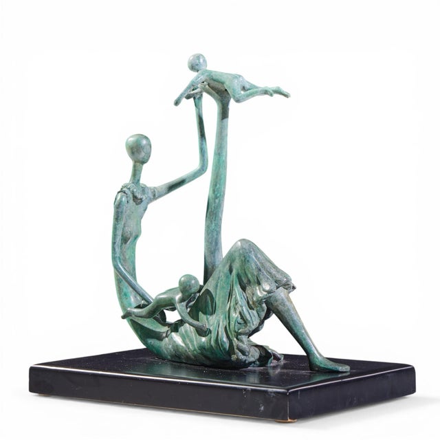 Ruth Bloch Bronze Mother and Children Signed 3/15 Sculpture This sculpture measures: 15.75 wide x 11.75 deep x 17.25...