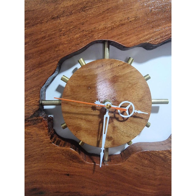 Meteor Through Time is a one-of-a-kind handcrafted wall clock sculpture created from carefully selected hard driftwood....