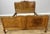 A beautifully crafted Vintage French Louis double bed frame , showcasing elegant curves and rich oak grain throughout....