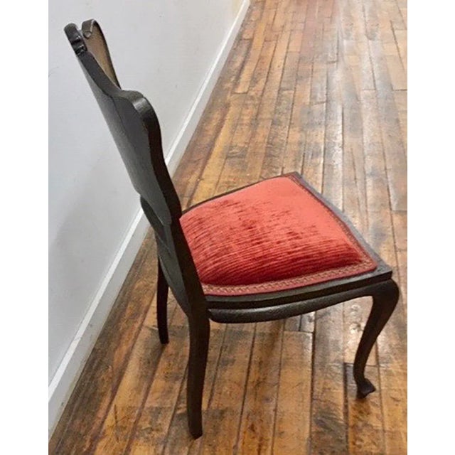 This early 20th-century Victorian Art Nouveau side chair features a hand-painted courting scene on its backrest with...