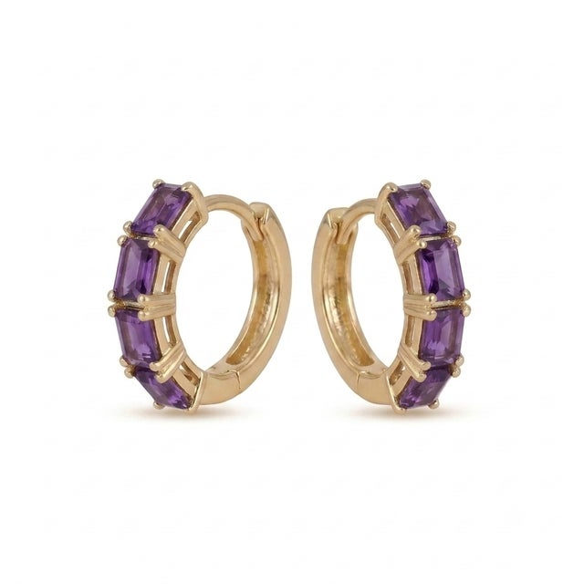 Infuse your jewelry collection with the regal charm of these exquisite amethyst baguette huggie hoop earrings. Each hoop...
