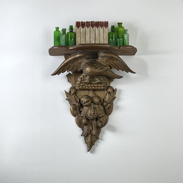 A 19th Century Carved Giltwood Wall Bracket A beautifully decorative wall shelf with larger proportions. The elegantly...