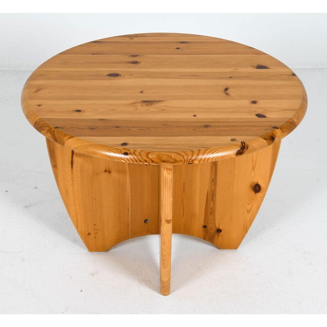 A fine Mid-Century Modern/Brutalist round coffee table in solid pine, made in the style of Rainer Daumiller in the 1970s...