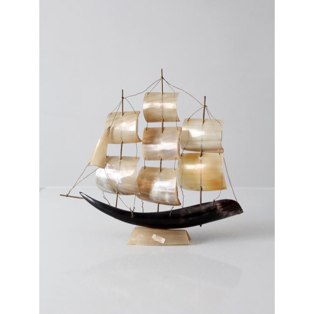 Mid-century Italian ship model crafted from genuine horn, featuring a black horn hull, translucent horn sails, brass...
