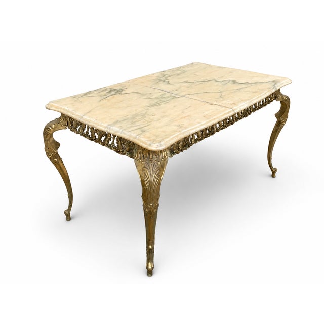 Louis XV style gilt bronze coffee table with a white veined marble top. The marble is cracked but functional. Dimensions:...