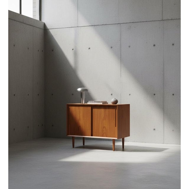 Low teak sideboard designed by svend aage rasmussen and produced by alderslyst møbelfabrik in denmark during the 1960s....
