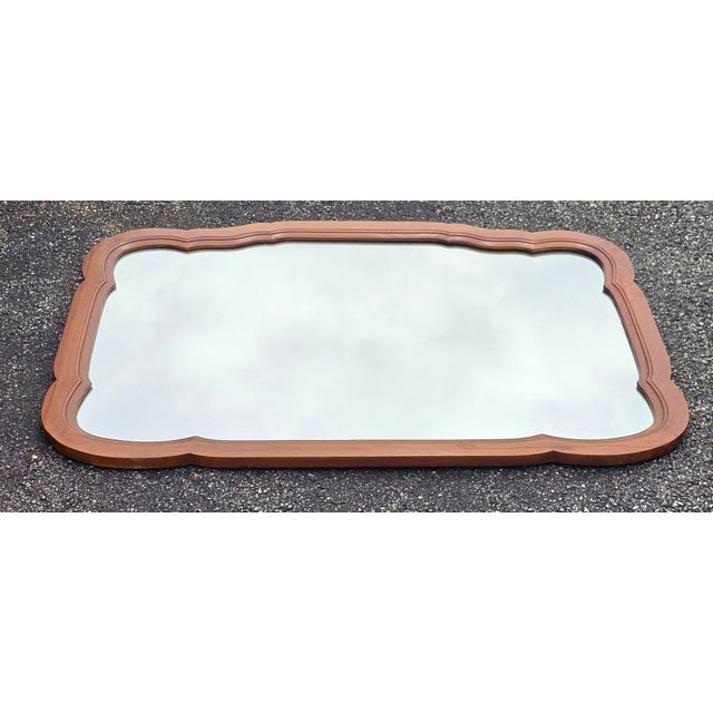 Mid Century Permacraft Provincial Style Carved Solid Cherry Wall Mirror, wood backing. Measures 38" in width, 30.5" in...