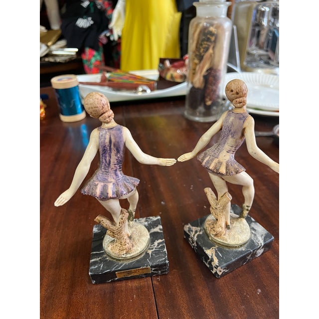 Up for consideration is a beautiful vintage pair of Italian ceramic ballerina figurines with marble bases. These would...