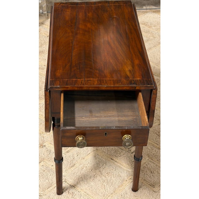 English Regency Mahogany Diminutive Drop-Leaf Side Table with Drawer, Circa 1830 A charming and highly functional English...