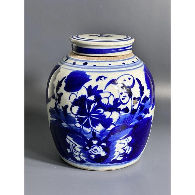 Chinese blue and white porcelain ginger jar from the 19th century decorated with stunning floral motifs. The resplendent...