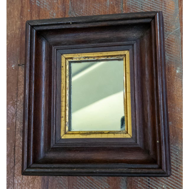 We are selling this adorable little mirror. This miniature mirror could have housed a portrait of photo at one time but...