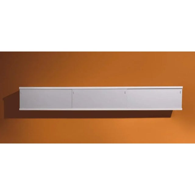 This Behr wall cabinet was designed by Horst Brüning in 1960. The cupboard was produced by Behr in Germany and is made of...