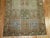 An antique Persian Bakhtiari rug with all-over garden box niche motif in earth tones 4'1'' x 6'4''