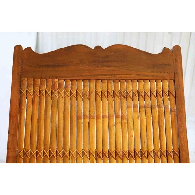 Pair of vintage wood and split bamboo plantation armchairs. Solid wood with split bamboo seats and backrests.. Please...