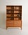 Oak bookcase with adjustable shelves and a storage compartment with rattan doors. Designed by Alf Svensson for Bjästa...
