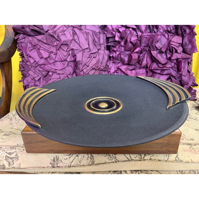 This exquisite Art Deco-style charger or centerpiece features bold geometric design elements that capture the elegance of...