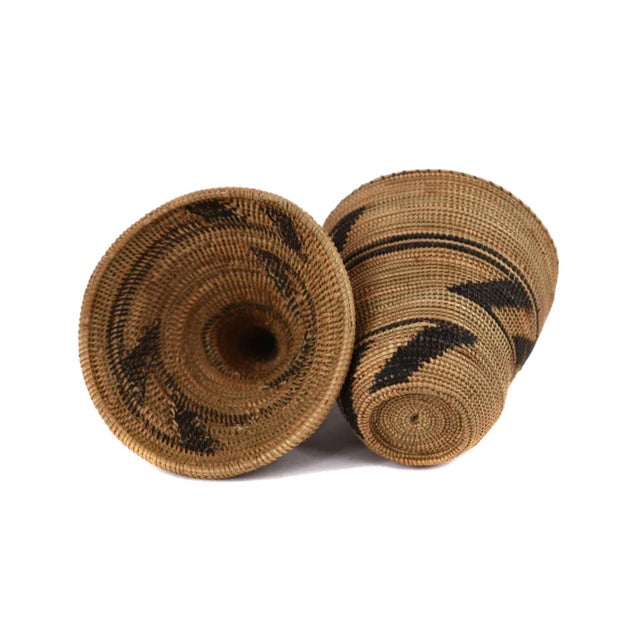 The Tutsi Tight Weave Basket with Lid from Rwanda epitomizes the artistry and tradition of the Tutsi community's weaving...