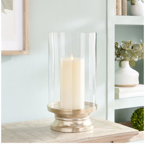The Large Brass Footed Lantern Size: 8.25 x 8.25 x 15.5 With a clean silhouette and a snow-on-brass finish, this footed...