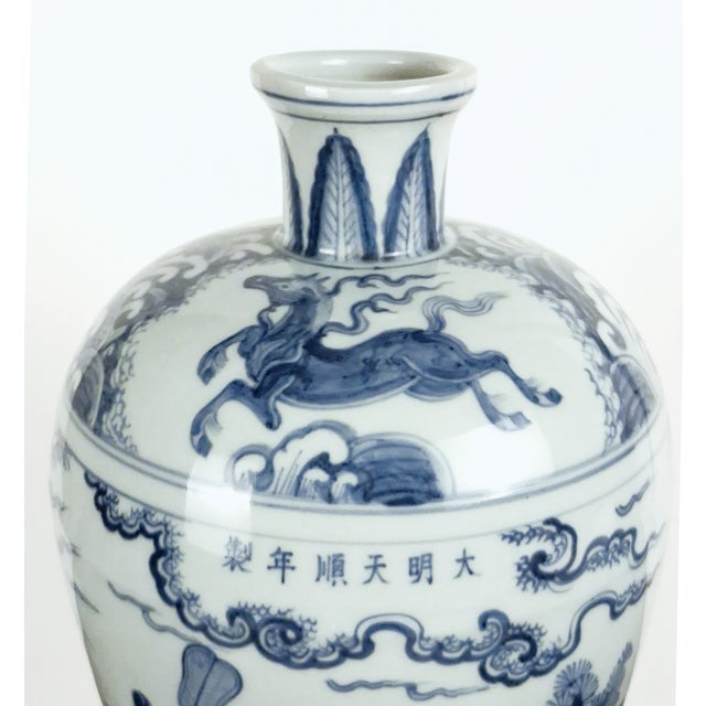 Chinese porcelain blue and white garden story meiping, a finely formed, plum shape vase with a blue and white glazed...