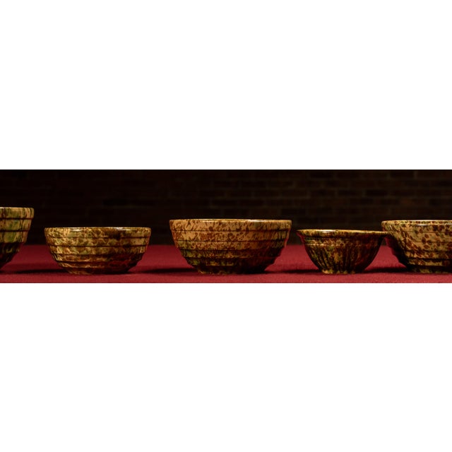 c. 1930s-1940s; Morton Pottery - Morton, IL Twelve-piece splatterware set in mottled green and brown glaze, produced by...