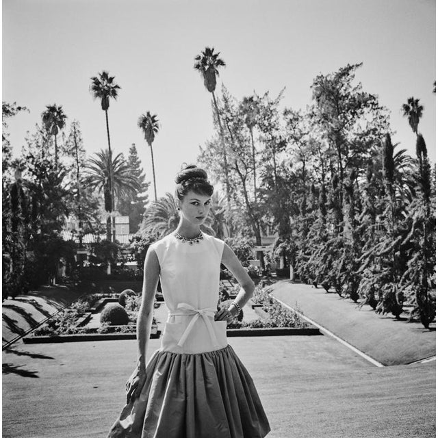 Beverly Hills Model 1960 Model Gretchen Van de Kamp Ward wearing a dinner dress by Gustave Tassell, Beverly Hills, 1960....