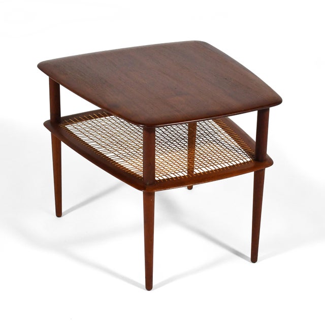 This Peter Hvidt & Orla Mølgaard-Nielsen model FD 521 side table from 1956 designed for France & Daverkosen features all...
