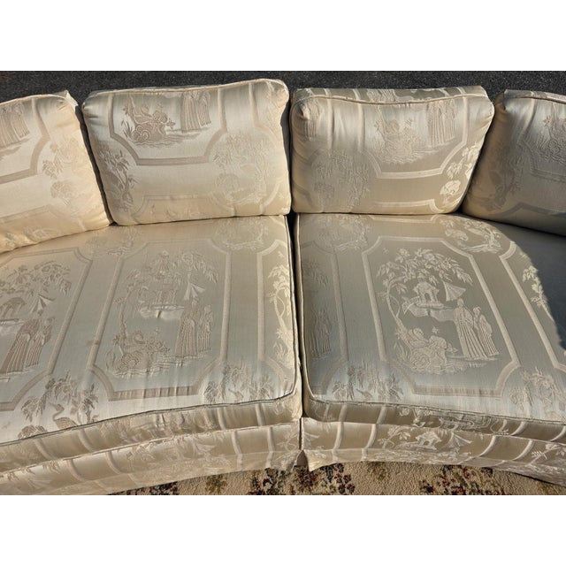 Elegant vintage curved sofa featuring cream chinoiserie jacquard upholstery with a beautiful woven scenic pattern. Its...