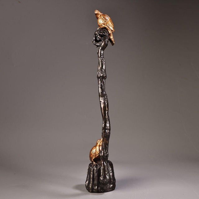 This is a cast bronze brush rest or sculptural stand featuring two gilt birds perched on a dark, organic form. The base is...