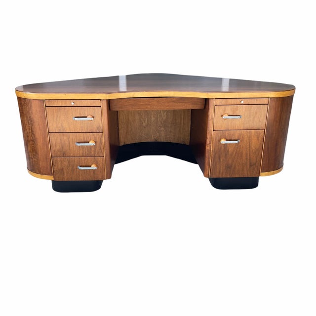 The Fletcher Aviation Desk is a large triangular shaped desk - reminiscent of an airplane wing - in a Moderne Art Deco...