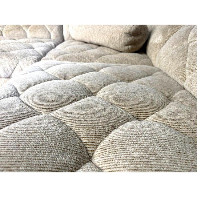 Seventies beige fabric fabric sofa with 6 modular elements and an armchair. Cool pattern in the fabric. The armchair has...