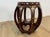 A stylish Chinese hardwood barrel-shaped stool with circular inset top, inlaid koi fish flowers and vines, pierced...