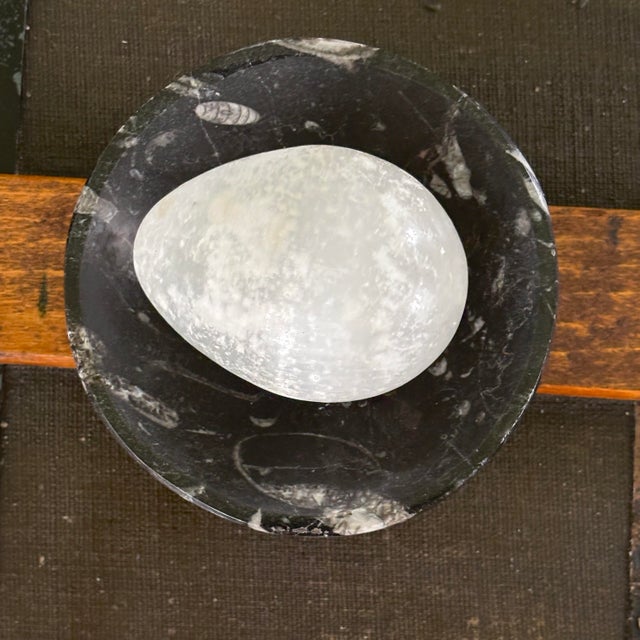 "A beautiful, natural 2-piece stone set for a vanity, desk, or shelf. A smooth, hand-polished 2.25-inch white crystal egg...