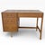A classic vintage oak dressing table or compact desk by Stag, showcasing clean mid-century lines and practical, well-...
