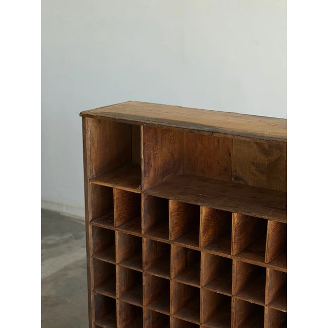 W45.5 D14 H49 Vintage bookcase structurally restored with original patinated finish. Unit features newly replaced areas of...