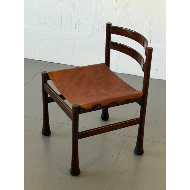 The same "Euro" model from Luciano Frigerio's Mobili Scultura tradition — solid jacaranda frames sculpted rather than...