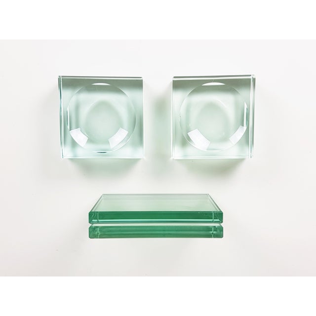 This set is composed by 2 glass ashtrays and 1 glass picture frame. Very good condition. Picture frame: cm 13h x 10w x...