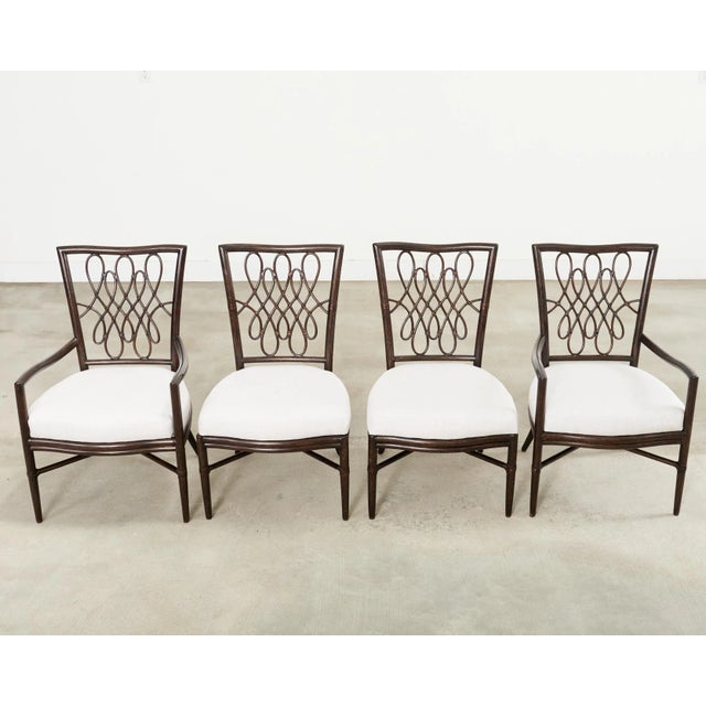 Whimsical set of four script dining chairs designed by Barbara Barry for Baker/McGuire. The set consists of two side...