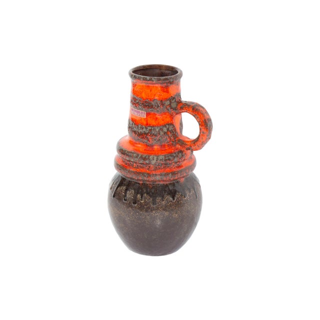A 1970s "Wien" handled ceramic vase produced by Scheurich Keramik. This West German vase has brown body with dripped glaze...