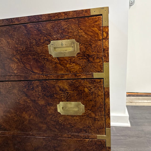 A campaign style faux tortoise effect veneered dresser from the 1970’s. Three drawers and of a small size. Has a piece if...
