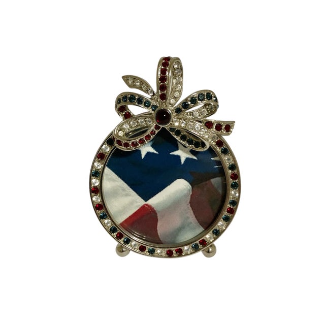 Elegant but fun red, white, and blue round frame with hand-set Swarovski crystals. Frame has a silver toned edge with red...