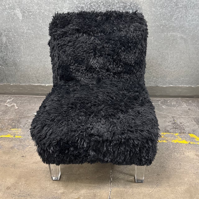 Design Plus Gallery presents a Black Faux Fur Acrylic Leg Slipper Chair from Skyline Furniture. This contemporary armless...