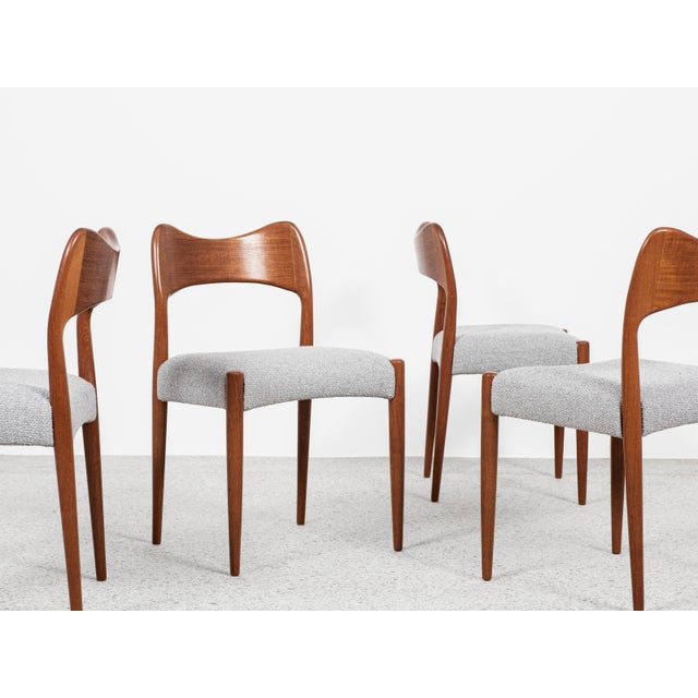 This set of 4 dining chairs is designed by Arne Hovmand Olsen and manufactured by Mogens Kold in Denmark in the 1960s....