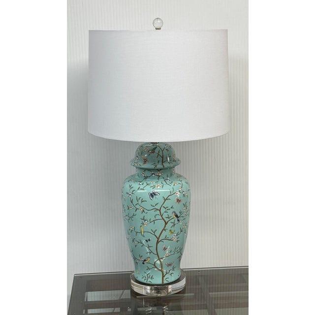 Design Plus Gallery presents a Birds + Butterfly Table Lamp in Jade Green Ceramic. The very becoming lamp has a soft...