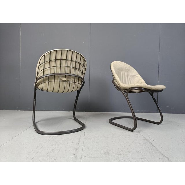 Vintage dining room chairs model 'Pascale' by Gastone Rinaldi for Rima Italy. The set consists of 5 chairs with dark brown...