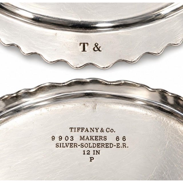 Two of Tiffany's silver-soldered, institutional grade round serving trays . Crisp/Well-Struck hallmarks denoting Tiffany's...