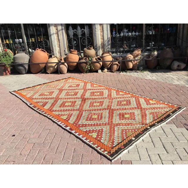 This beautiful, vintage, handwoven kilim is approximately 60 years old. It is handmade, of very fine quality hand spun...