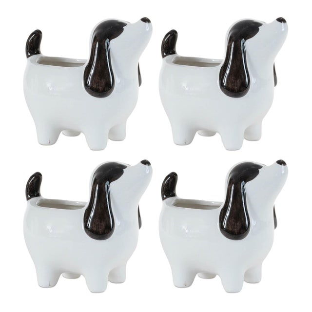 Bring a touch of charm and whimsy to your space with this set of four Puppy Dog Planters. Crafted from durable polyresin...