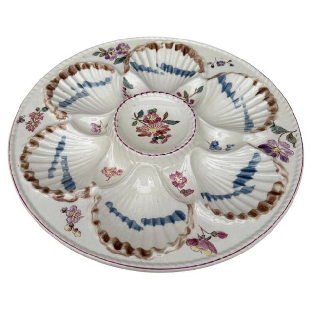 French Majolica oyster plate with flowers circa 1890 signed Longchamp.