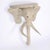 Whimsical pair of elephant head consoles crafted with a sturdy metal frame wrapped with reed.