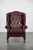 This elegant cowhide wing chair is the perfect addition for Chesterfield furniture enthusiasts. Its beautiful red color...